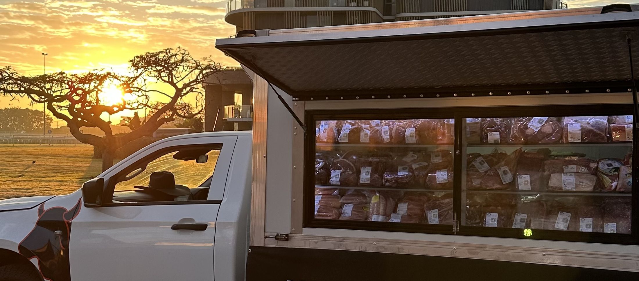 The Know Your Farmer truck set up at the markets at sunrise